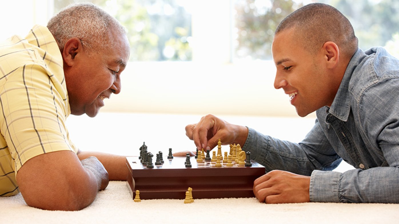 Father and son playing chess