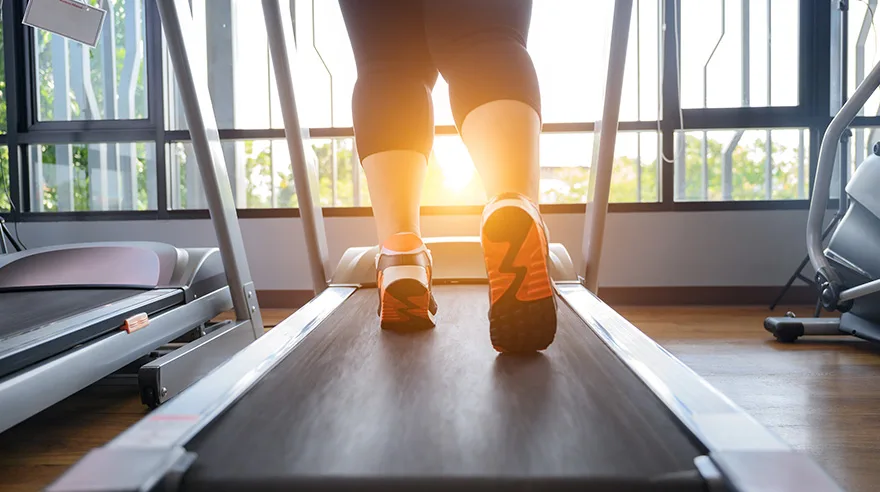 Woman walking on treadmill