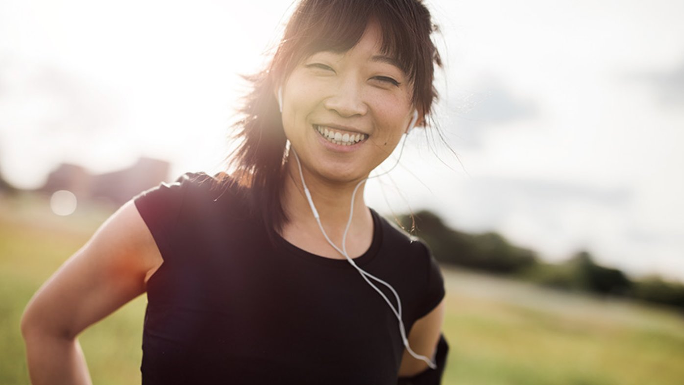 Happy woman exercising outdoors