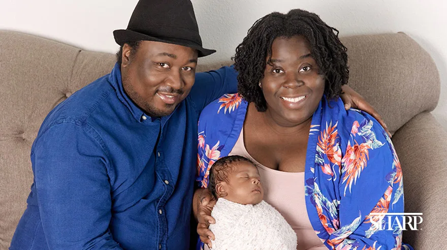 Mary Elise Porter with her husband and baby