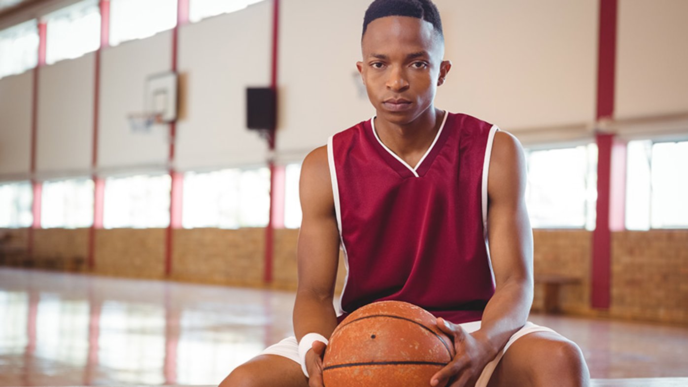 Teen athlete with basketball