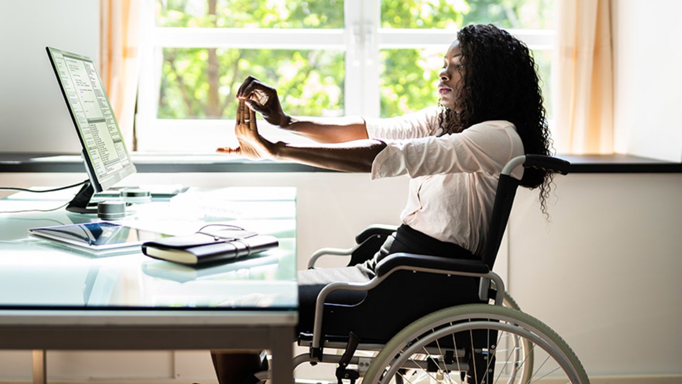 Woman working on laptop at desk