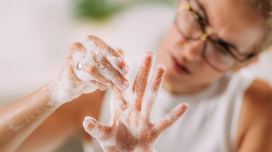 Woman washing her hands