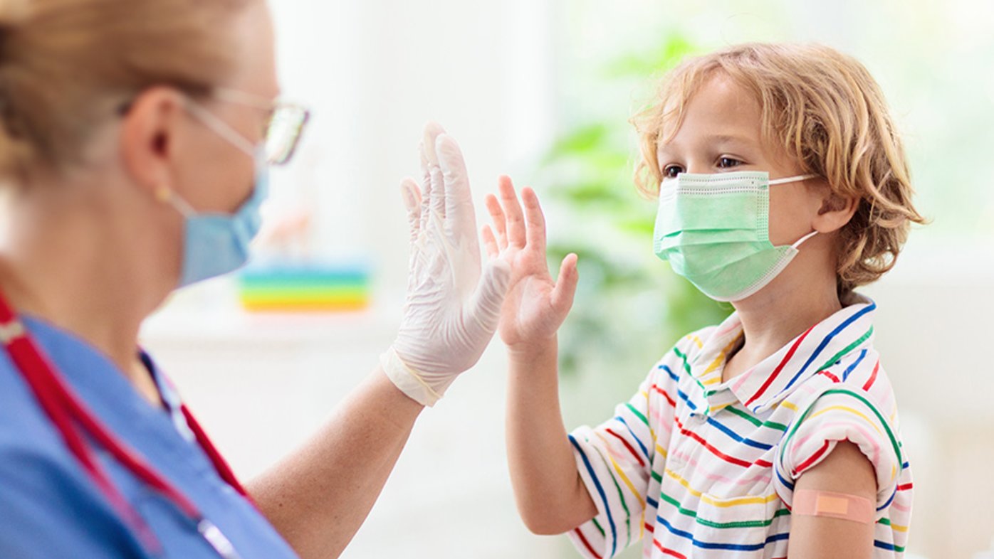 Child and doctor wearing masks