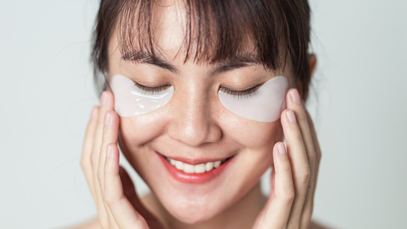 Woman using silicone patches for fine lines