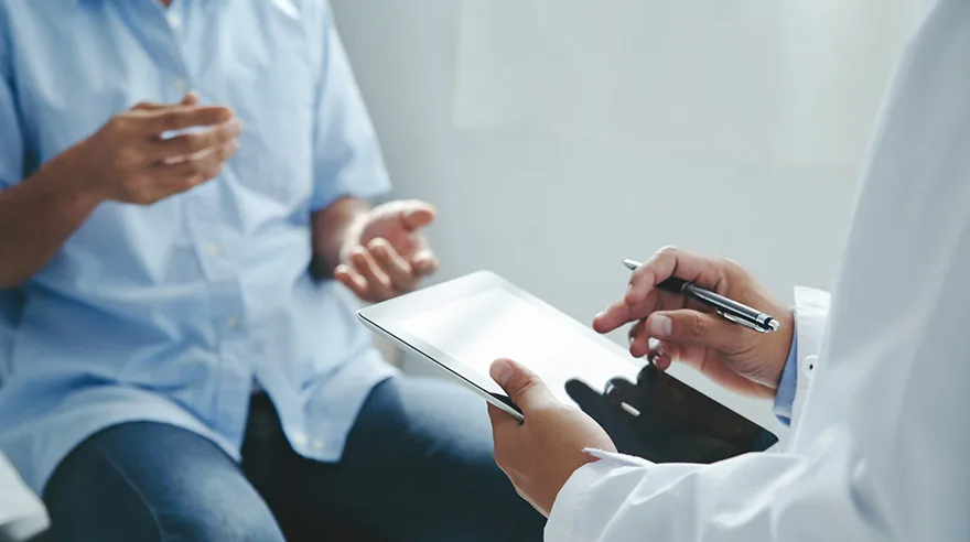 Patient talking to doctor