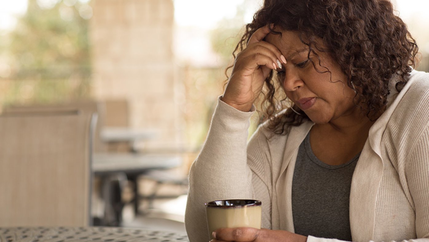 Woman drinking coffee feeling tired