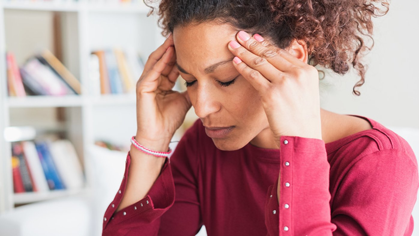 Woman experiencing a headache