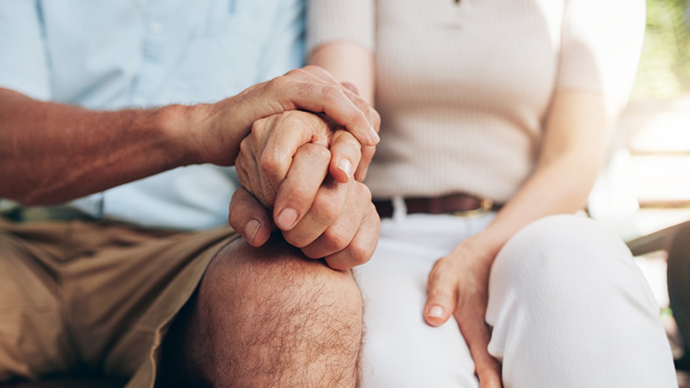 Couple holding hands