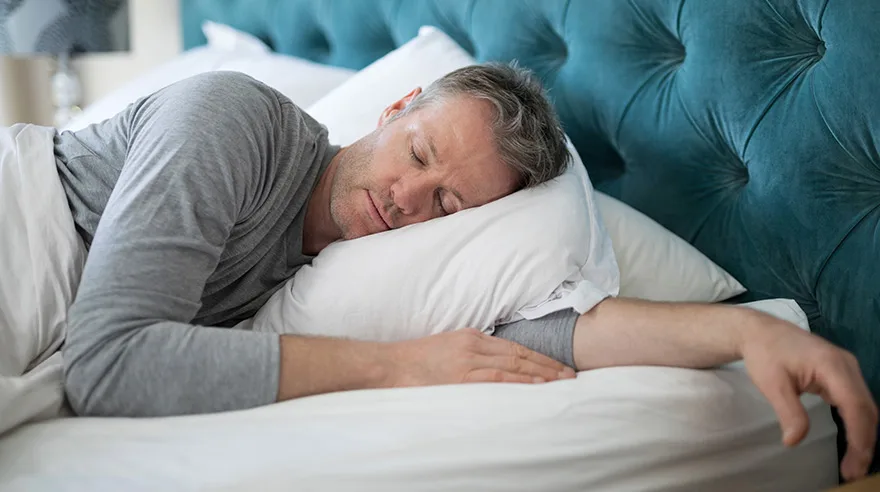 Man asleep in bed