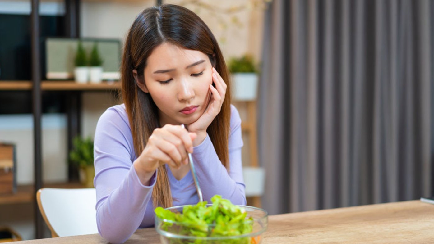 Woman eating salad