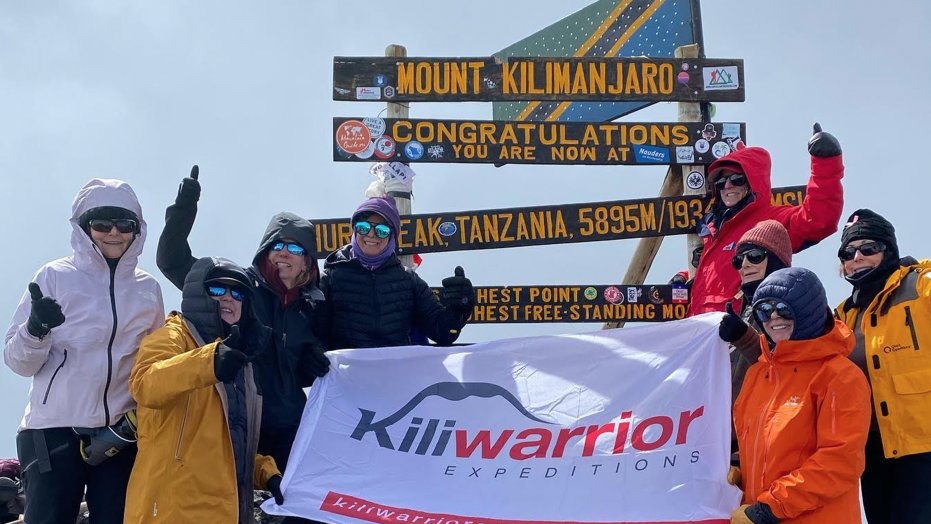 The "Kiliqueens" on the summit of Mount Kilimanjaro.