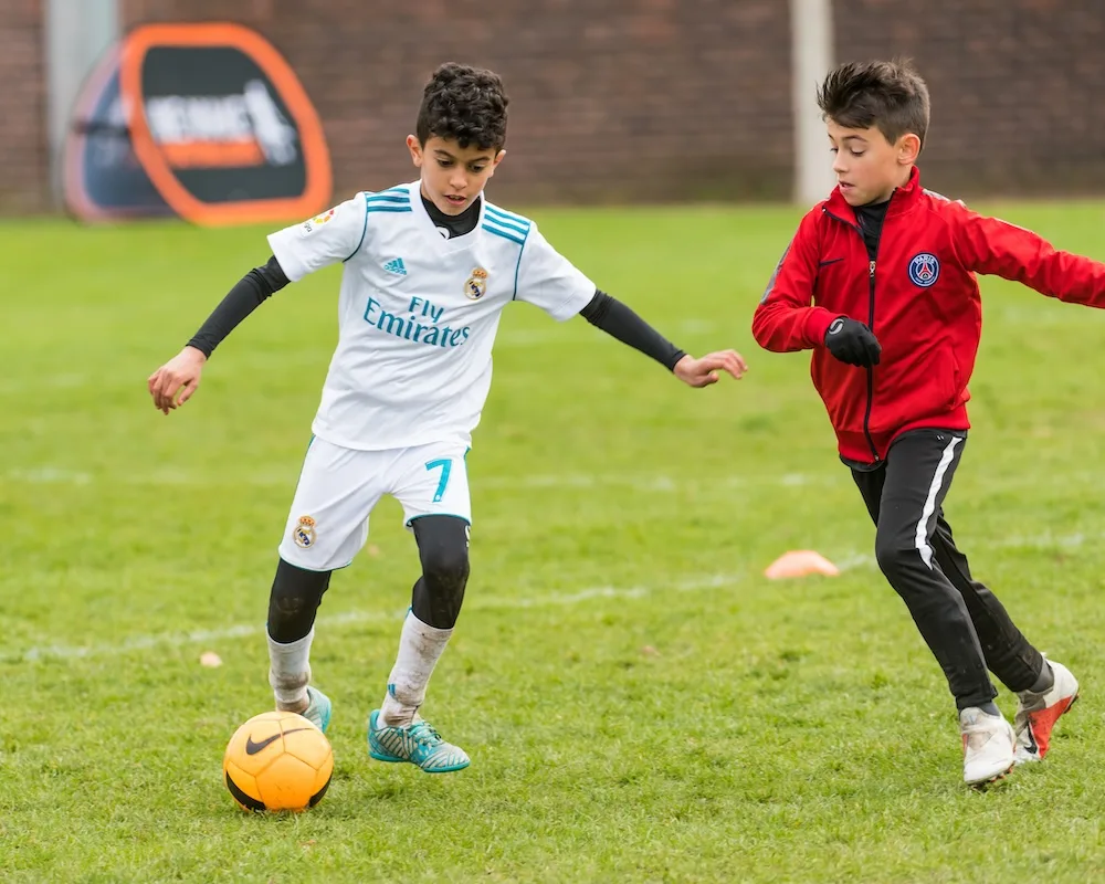 Coach helping young player