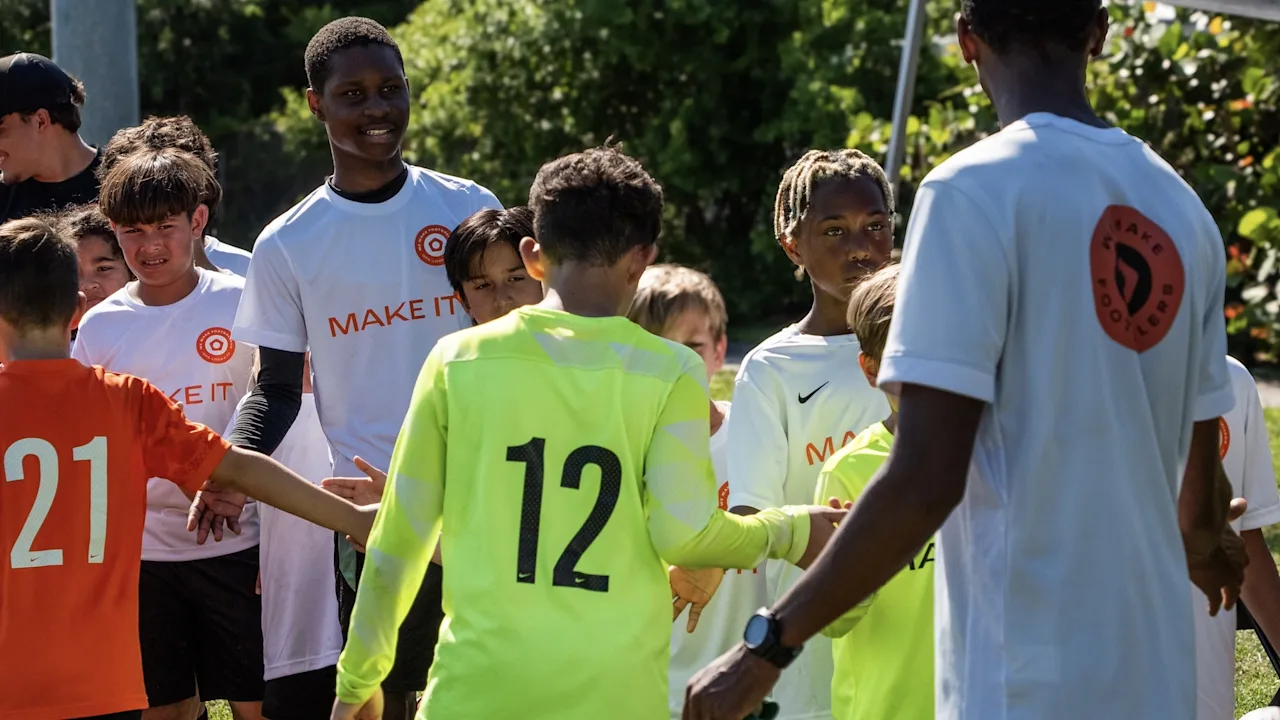 Children playing competitive team football