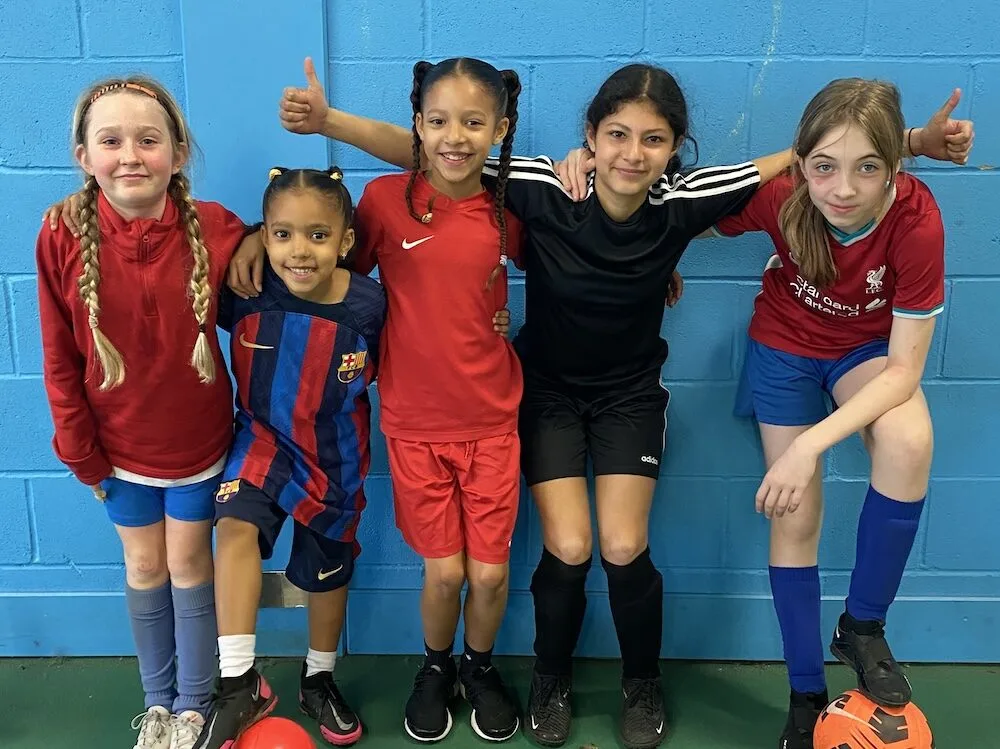 Girls enjoying football training together