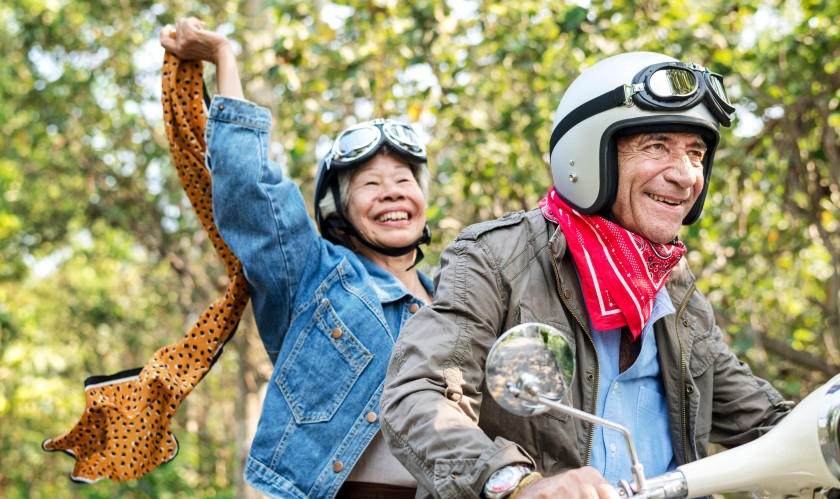 Older couple on motorcycle joy of sight