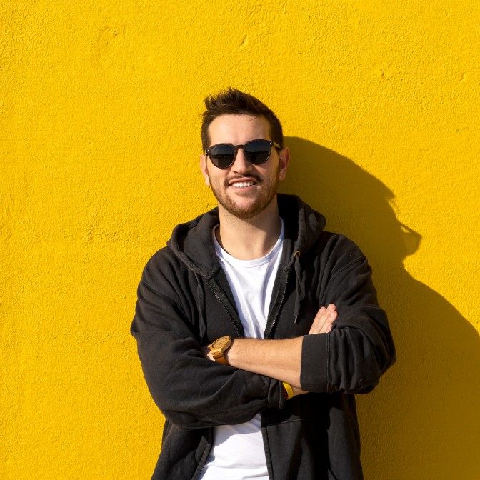 Man smiling wearing prescription sunglasses