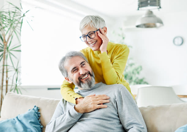 Older couple at home husband wife wearing prescription lenses cataract surgery