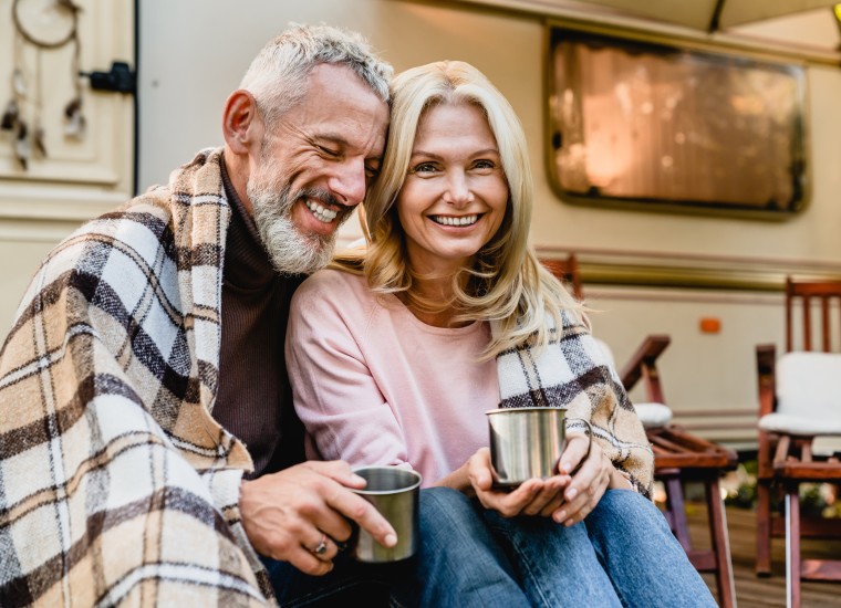 Happy older couple glaucoma and cataract patient enjoying outdoors