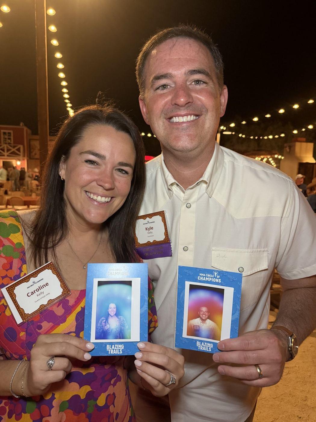 A%20couple%20holds%20their%20aura%20prints%20at%20an%20evening%20private%20event.%20Photo%3A%20The%20Aura%20Journey.