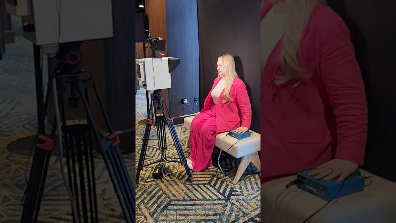 A%20guest%20sits%20for%20her%20aura%20photo%20at%20Sol%20de%20Janeiro%27s%20activation%20at%20the%20Amazon%20Creator%20Summit.%20Photo%3A%20The%20Aura%20Journey.