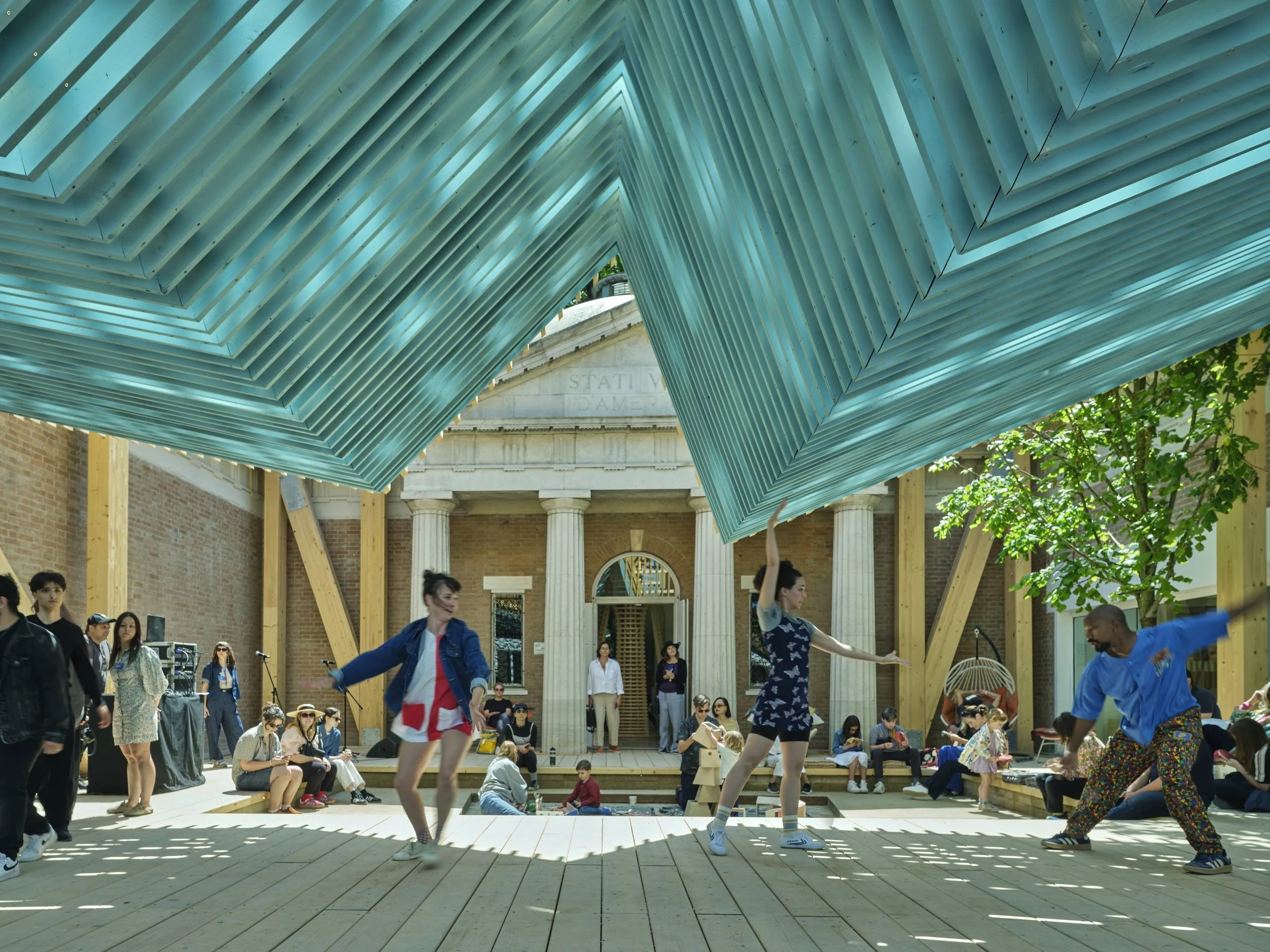 Outdoor Dance Performance with Layered Slat Canopy