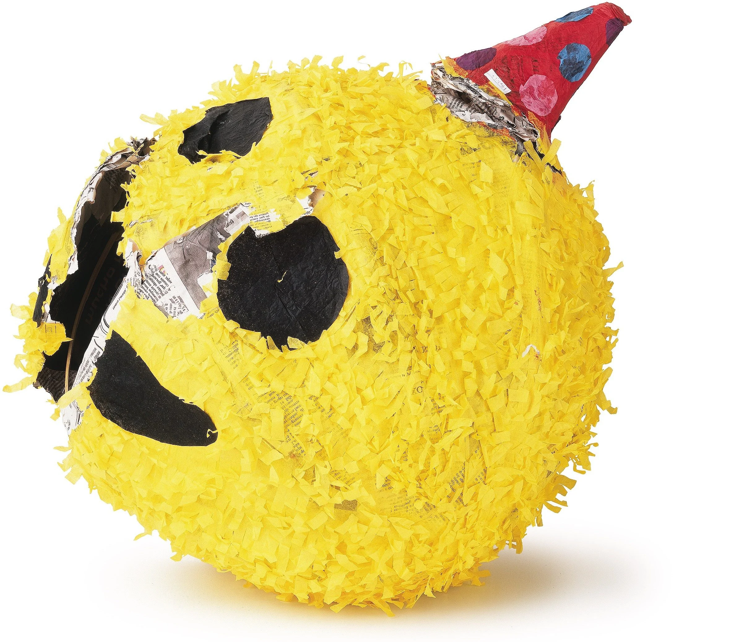 Yellow emoji face piñata with a red party hat and visible tears in the paper covering.