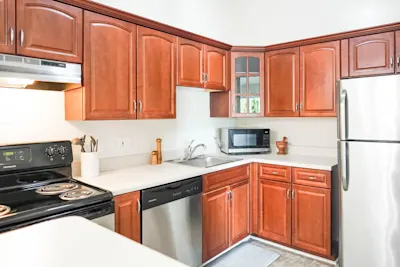 The Cardinal - 1 Bed 1 Bath - Kitchen - Cherry Style Cabinets