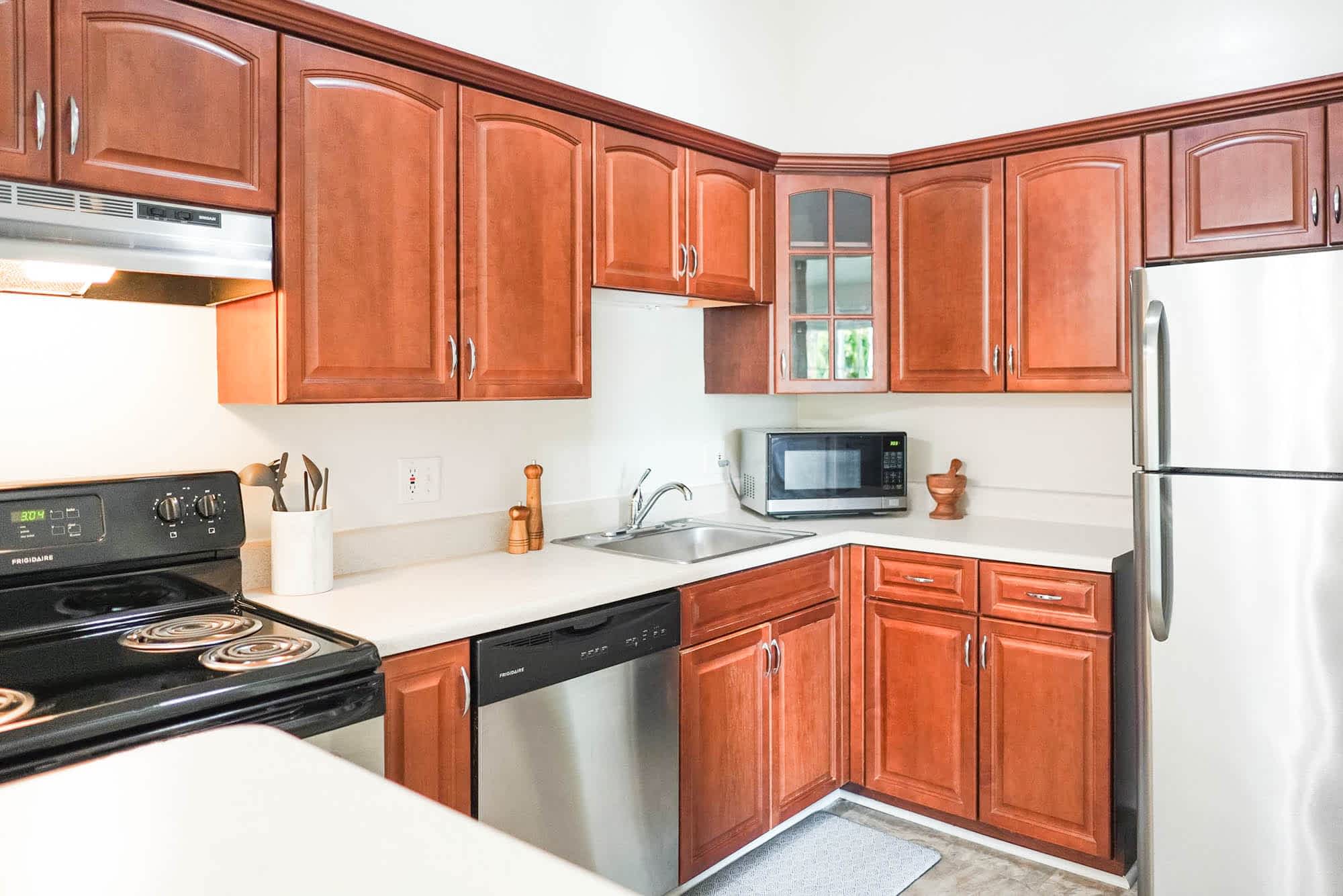 The Cardinal - 1 Bed 1 Bath - Kitchen - Cherry Style Cabinets