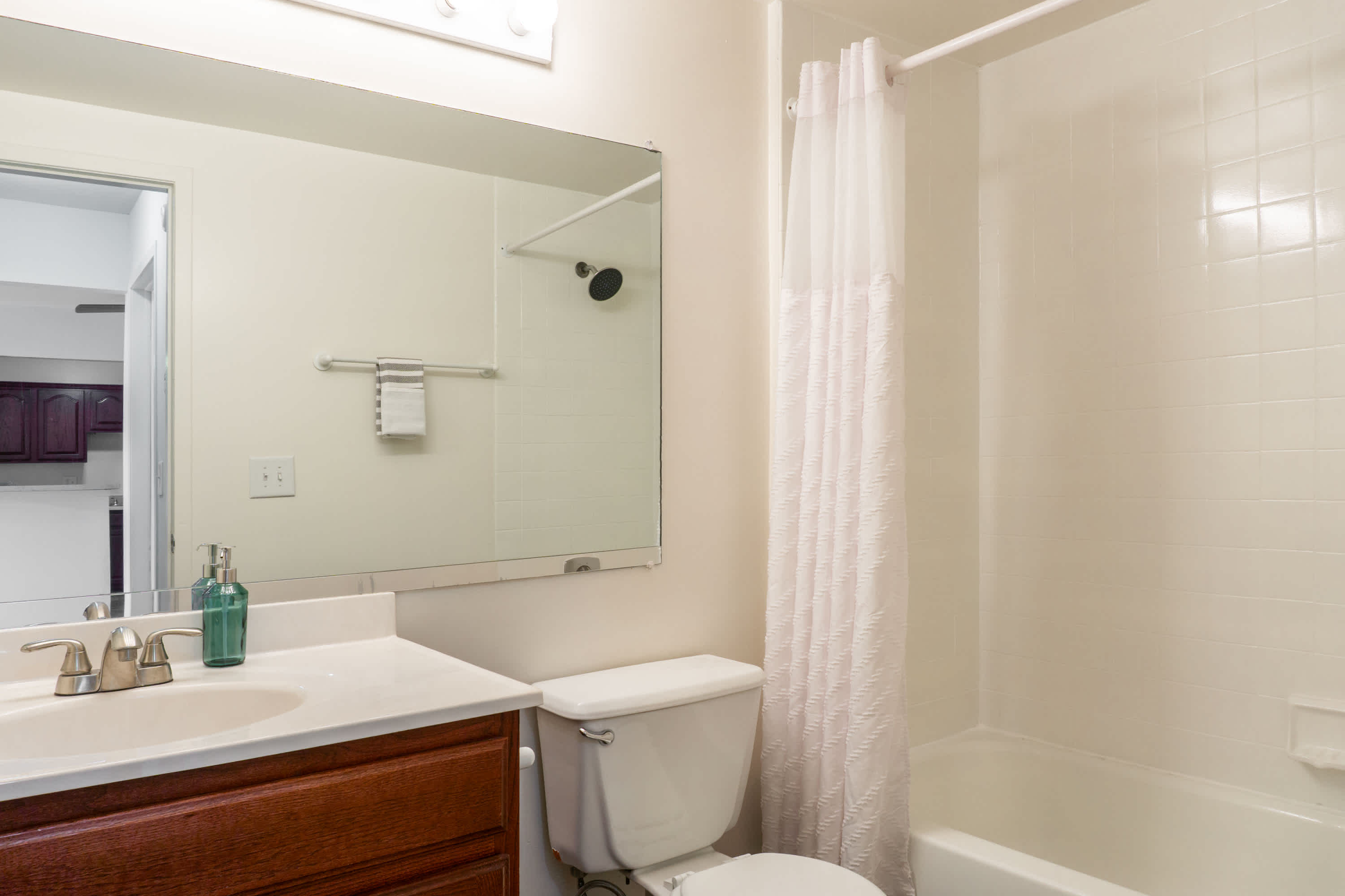 The Blue Heron - 2 Bed 2 Bath - Primary Bathroom - Oak Style Cabinets