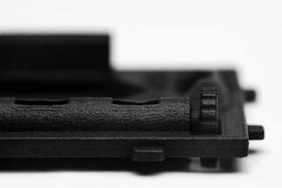 Close up image on SLS tumbled part in dyed black colour