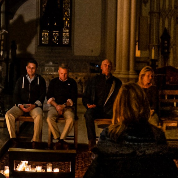 Group of people silently meditating together