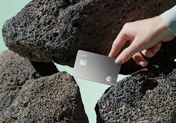 Metal card on rocks.