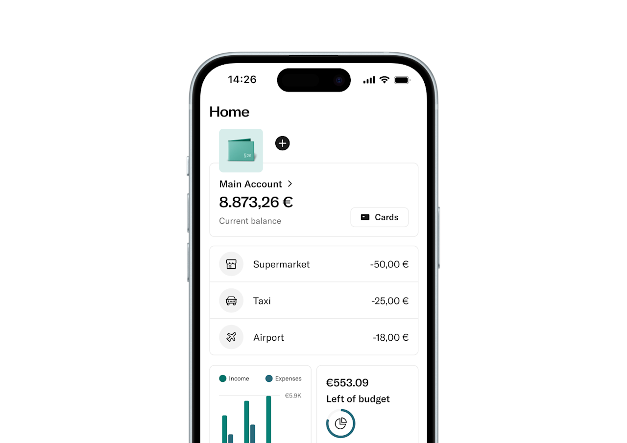A smartphone screen displays the N26 banking app's home page, showing the account balance and recent transactions.