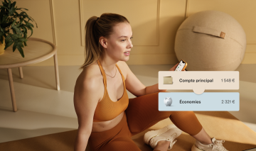 Image d'une femme en tenue de sport assise sur un tapis de yoga.