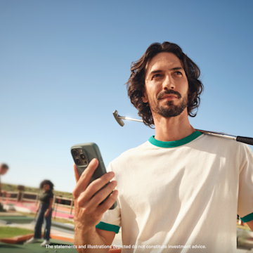 A man on a mini-golf course holds a phone with the large N26 logo overlaid.