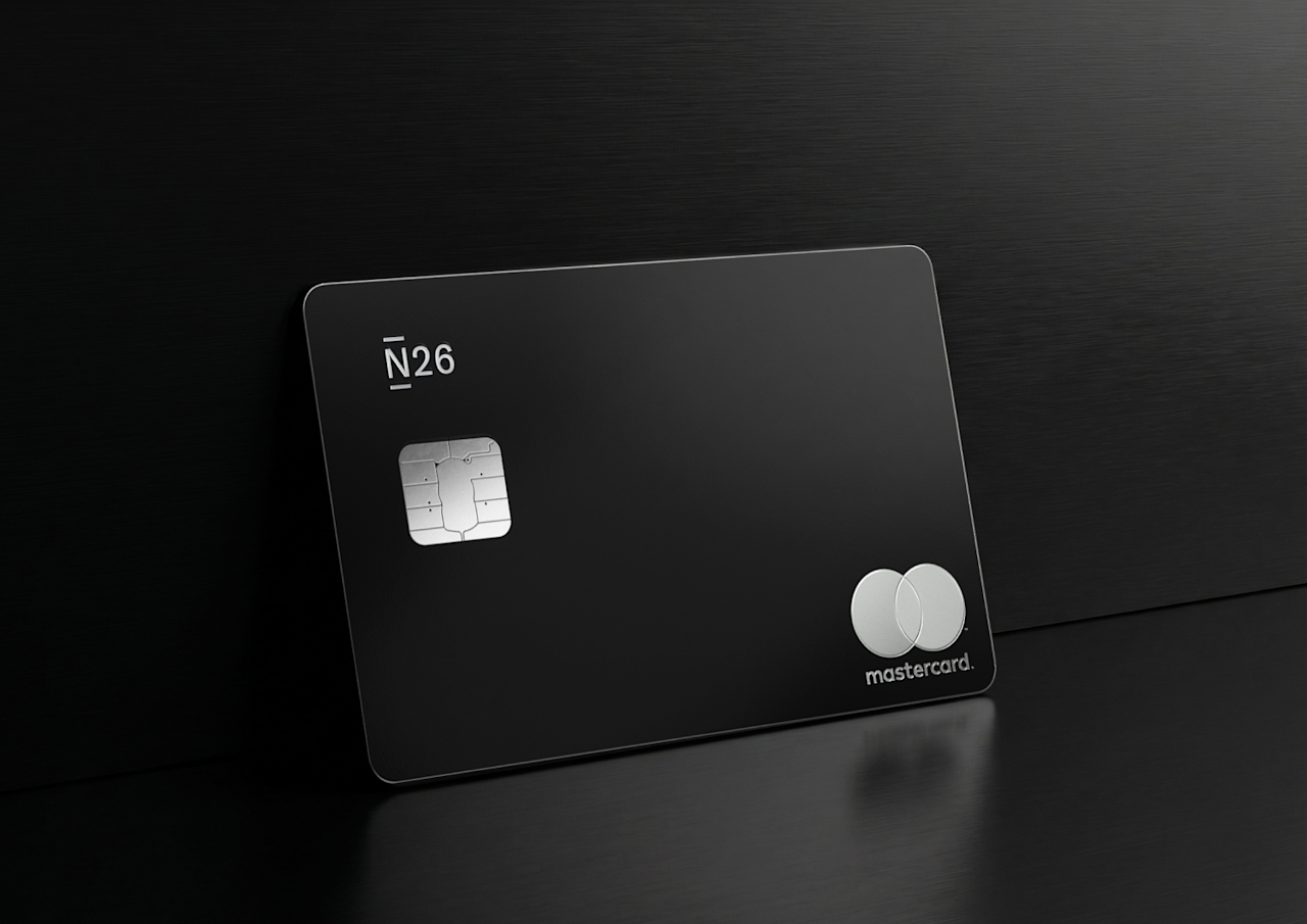 A physical black N26 Metal Mastercard stands against a dark, brushed metallic background.