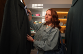 A woman shops for clothes. 