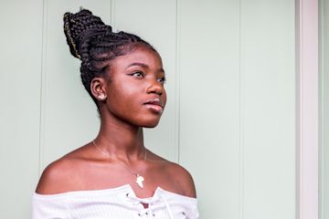 Woman looks out into the distance.