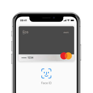 An iPhone X with the Apple Pay screen open on it.