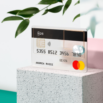 Standard N26 card on top of a brick with Forbes best bank logo.
