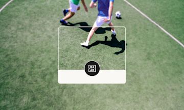 two football players on the grass.