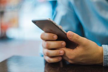 hands holding a smartphone.