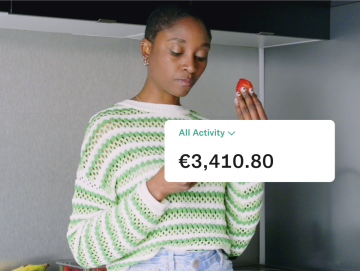 N26 all activity icon showing 3418 euros with a background image of a woman eating a delicious strawberry.