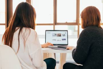 a freelancer pitching her own idea to her client with a PC.