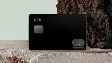 Black "N26 Metal" card on top of a concrete block.