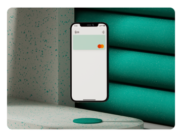 Un smartphone flotando muestra la tarjeta virtual de N26 en la pantalla.