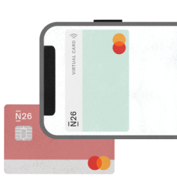 Kartu virtual ditampilkan pada smartphone dan kartu debit di belakang.
