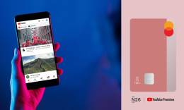 Youtube Premium showing on a phone and pink N26 You card.
