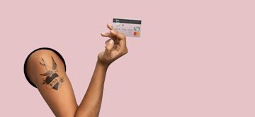 An elevated hand holding a transparent N26 Standard card.